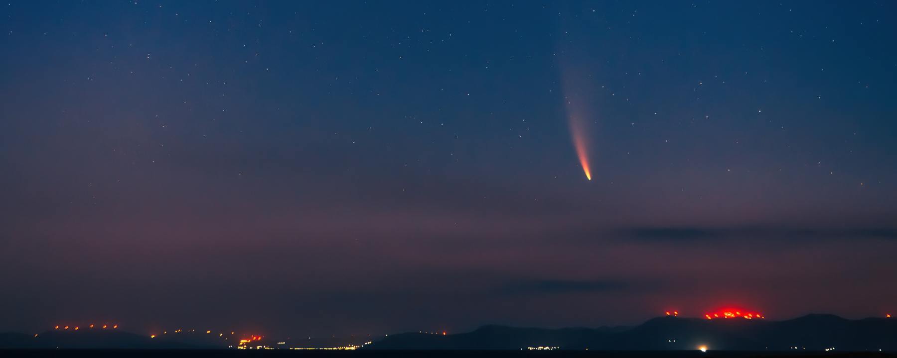 fireball of a meteor descending upon a city
