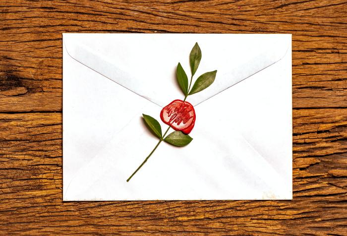 a letter sealed with wax imprinted "with love"