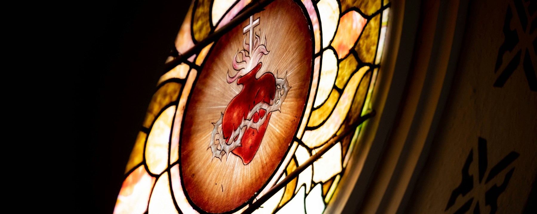 Sacred Heart of Jesus in a golden rimmed stained glass