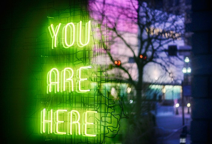 A neon sign saying you are here
