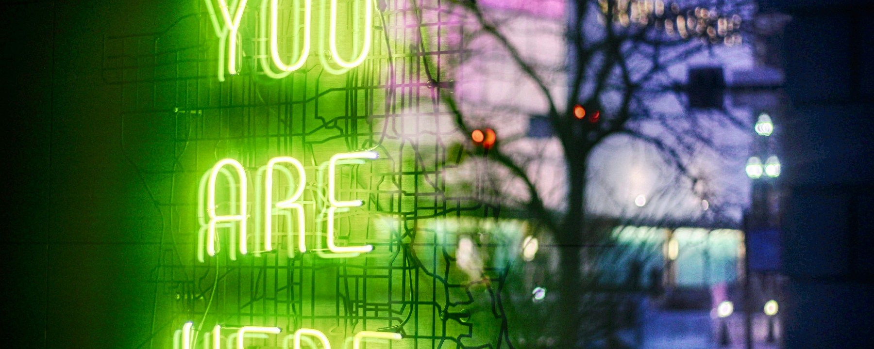 A neon sign saying you are here