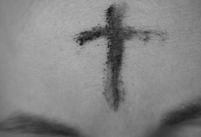 Image of a cross in ashes on a forehead
