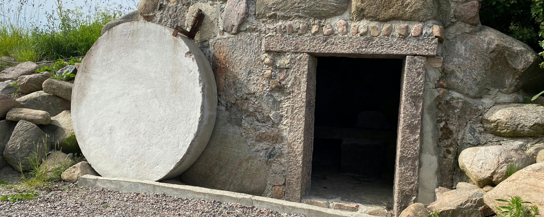 An open tomb with the stone rolled away